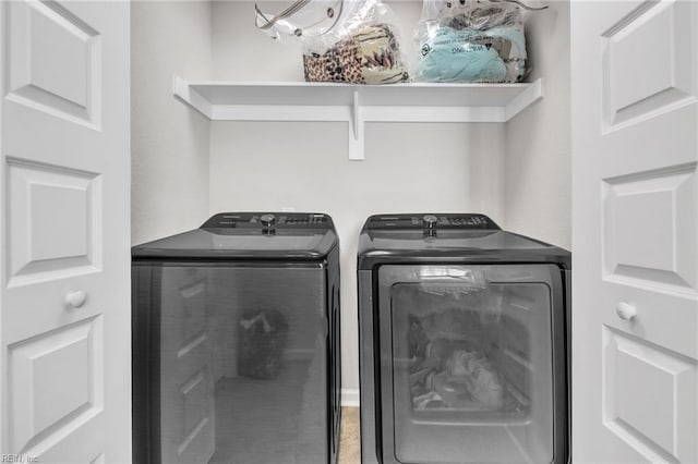 laundry room with separate washer and dryer