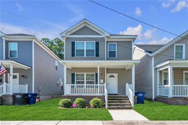 view of front of house with a porch and a front yard