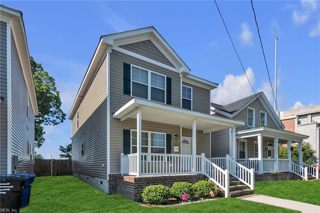 view of front of home with a porch and a front lawn