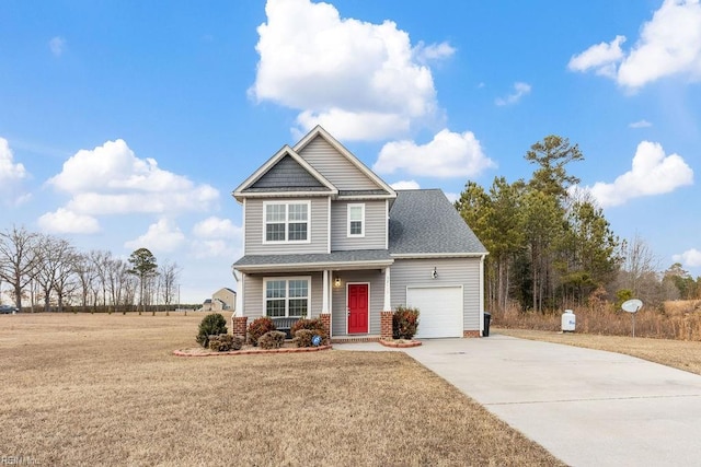 view of front of home with a garage and a front lawn