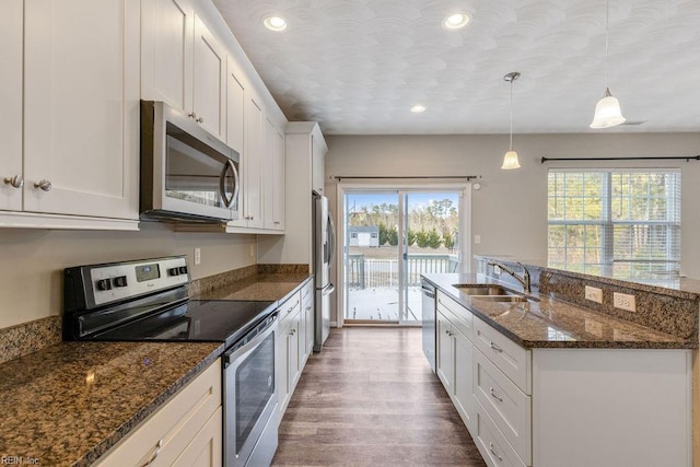 kitchen with sink, stainless steel appliances, and white cabinets