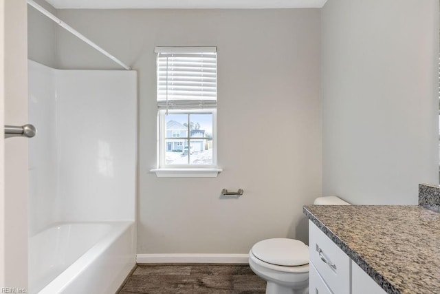 full bathroom featuring shower / tub combination, vanity, hardwood / wood-style flooring, and toilet