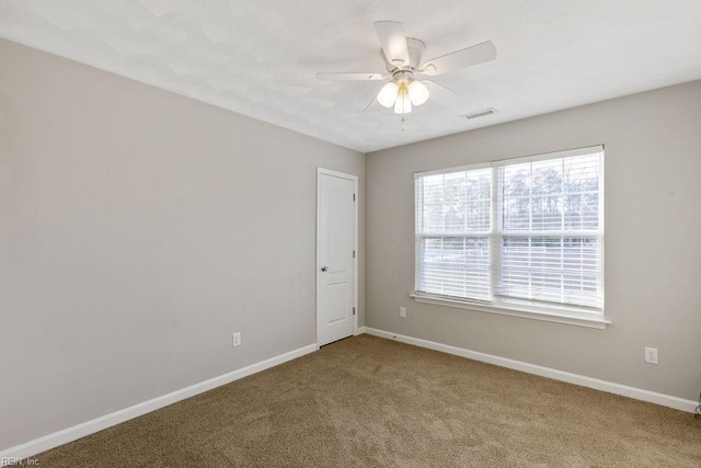 unfurnished room featuring carpet floors and ceiling fan