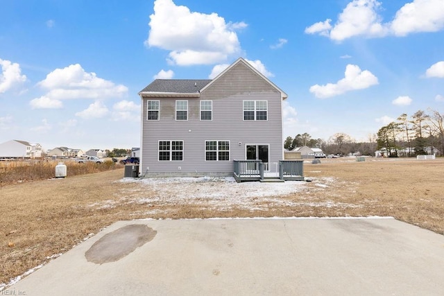 back of house featuring a wooden deck