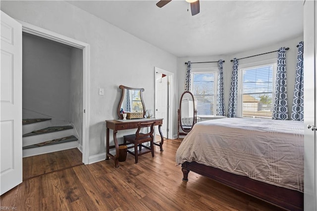 bedroom with dark wood-type flooring and ceiling fan