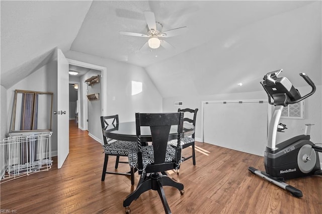 dining area with vaulted ceiling, hardwood / wood-style floors, and ceiling fan