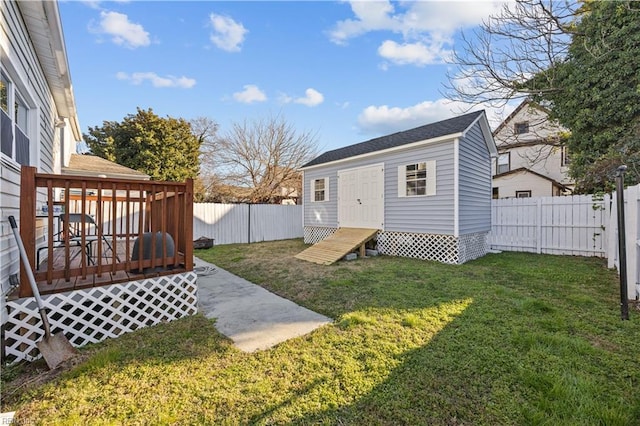 view of yard featuring an outbuilding and a deck