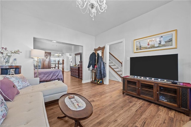 living room featuring hardwood / wood-style flooring and a chandelier