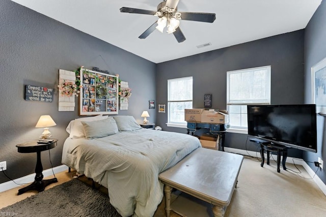 bedroom with ceiling fan and carpet floors