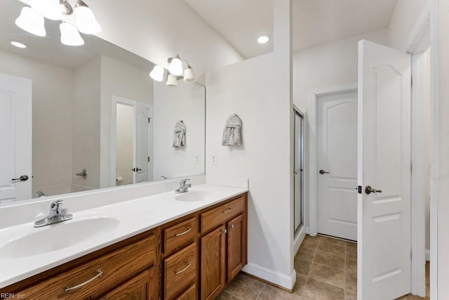 bathroom featuring an enclosed shower and vanity