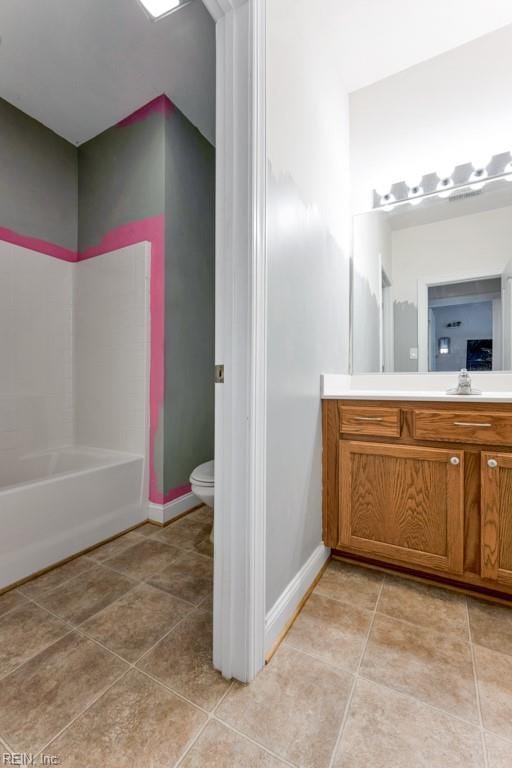 bathroom with toilet and vanity