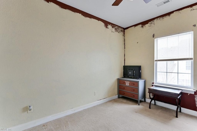 miscellaneous room with ceiling fan and light carpet