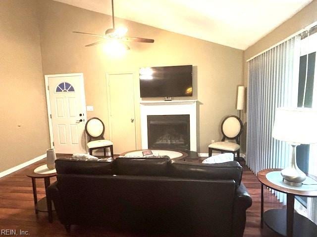 living room featuring ceiling fan, lofted ceiling, and dark hardwood / wood-style floors