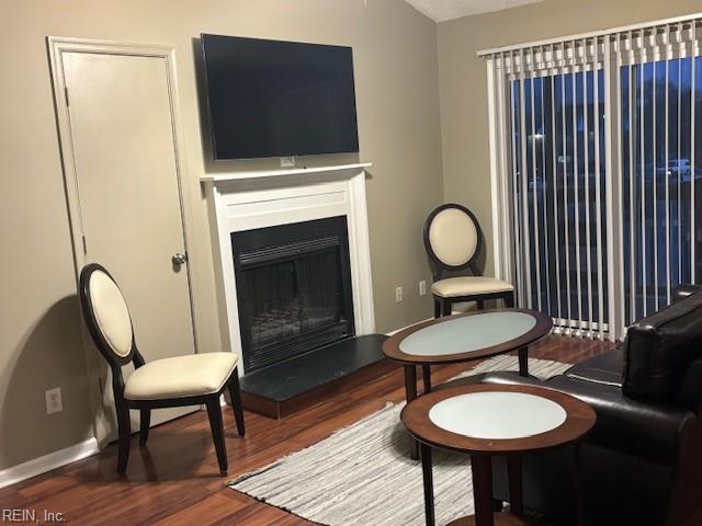 sitting room with hardwood / wood-style floors