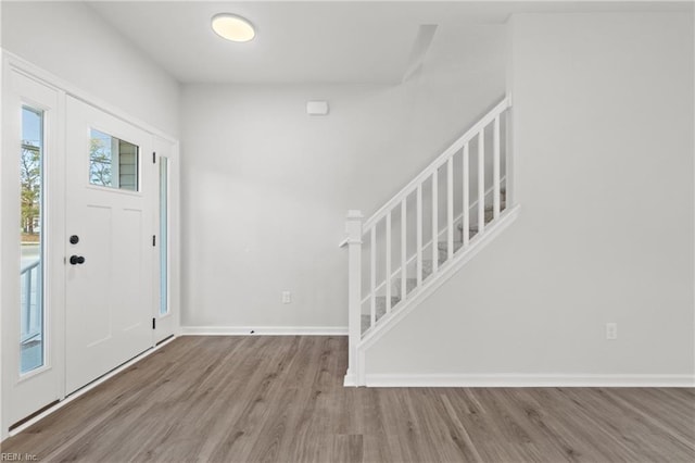 entryway with light hardwood / wood-style flooring