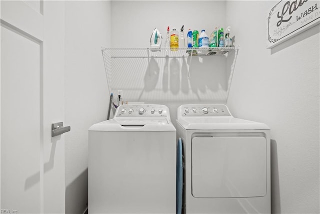 clothes washing area featuring washing machine and dryer