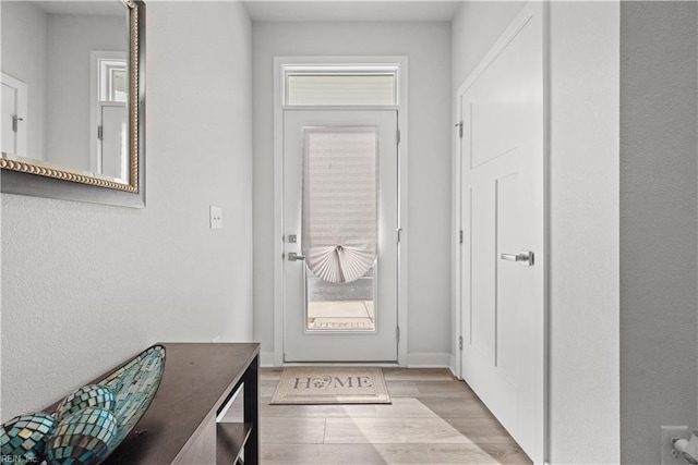 doorway to outside featuring light wood-type flooring