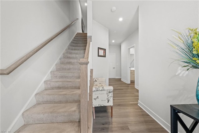 stairway featuring hardwood / wood-style flooring