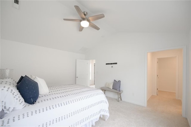 carpeted bedroom featuring lofted ceiling and ceiling fan