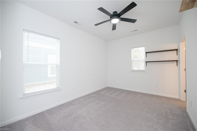 carpeted empty room with ceiling fan