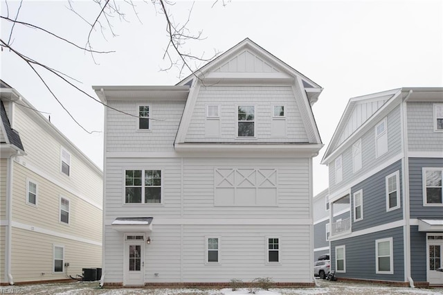 back of property featuring central AC unit