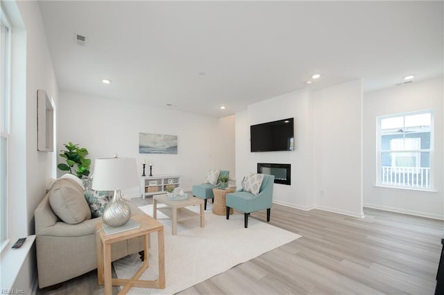 living room with light hardwood / wood-style flooring