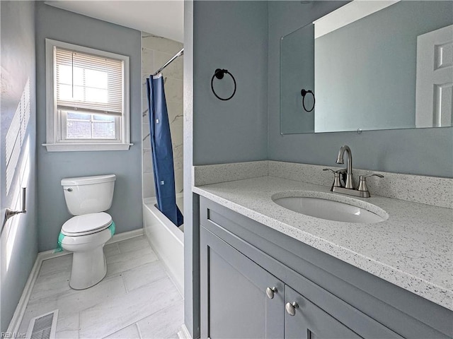 full bathroom featuring tile patterned flooring, vanity, shower / tub combo with curtain, and toilet