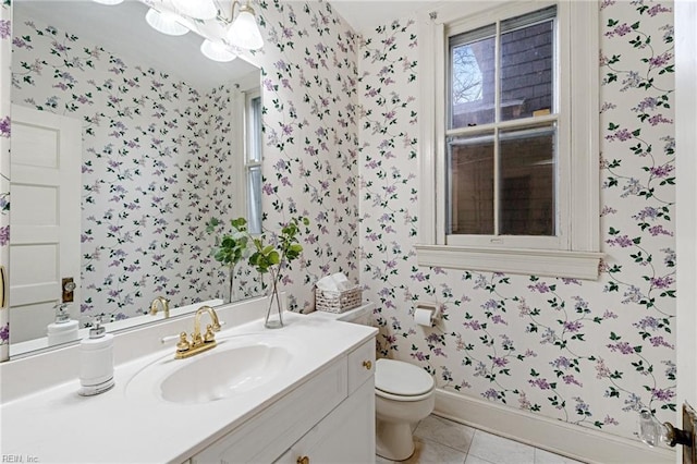 bathroom with vanity, toilet, and tile patterned flooring