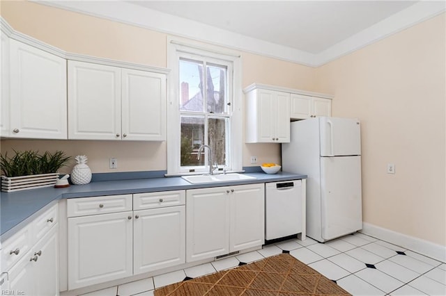 kitchen with white cabinetry, sink, white appliances, and light tile patterned floors