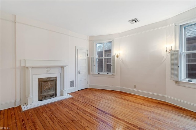 unfurnished living room featuring light hardwood / wood-style floors