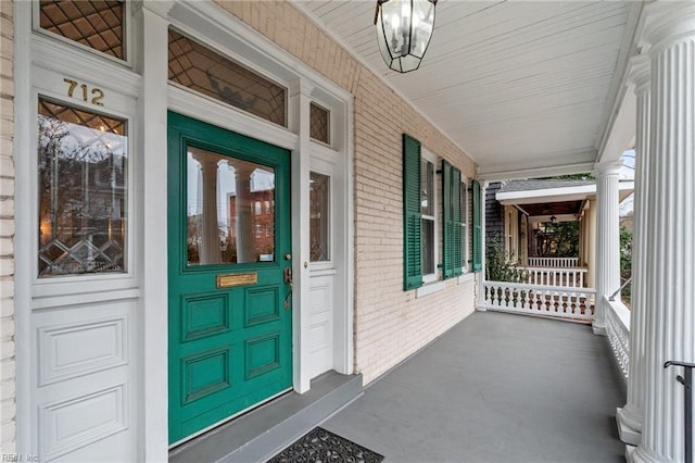 doorway to property with covered porch