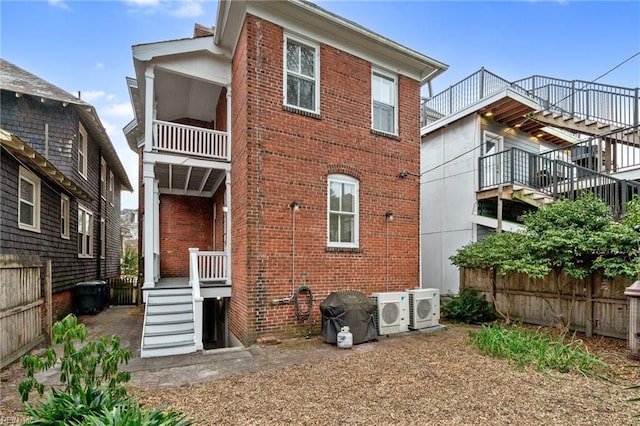 rear view of house with ac unit