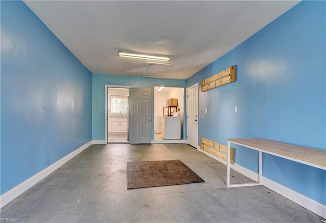 interior space featuring washer / dryer and concrete floors