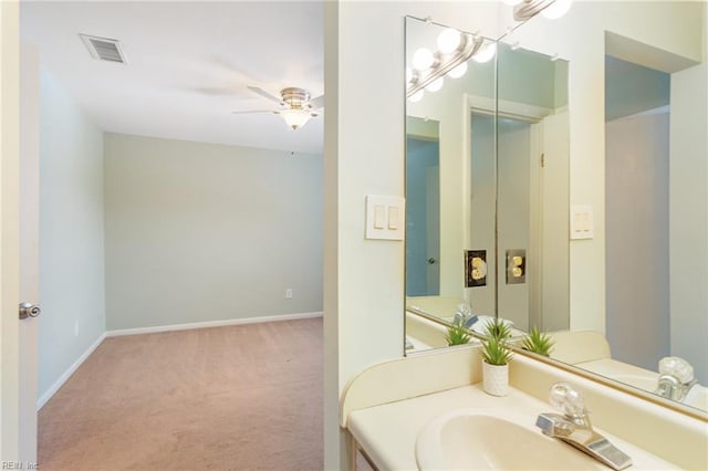 bathroom featuring ceiling fan and vanity