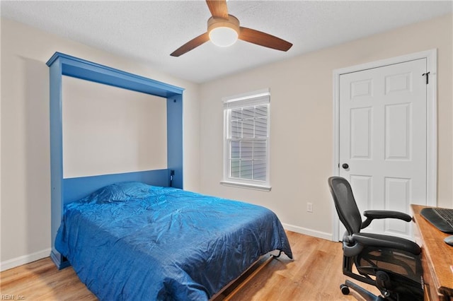 bedroom featuring hardwood / wood-style flooring and ceiling fan