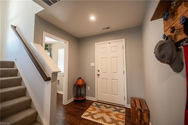 foyer with dark hardwood / wood-style flooring