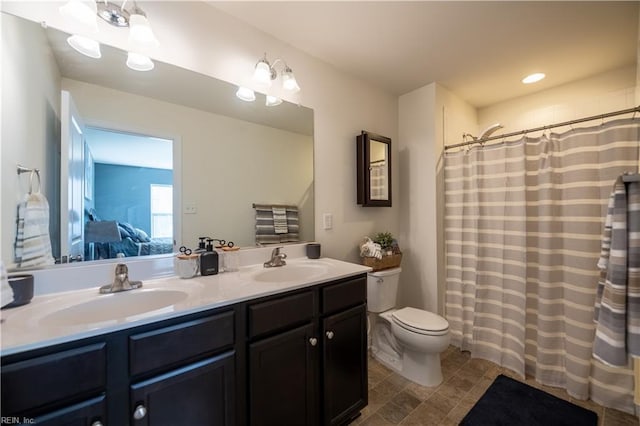 bathroom with vanity and toilet