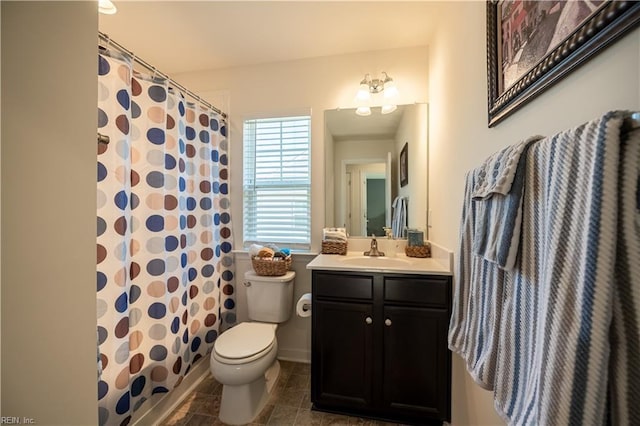 bathroom featuring vanity, toilet, and a shower with shower curtain