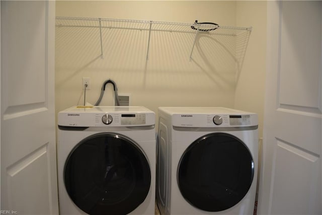 washroom with washing machine and dryer