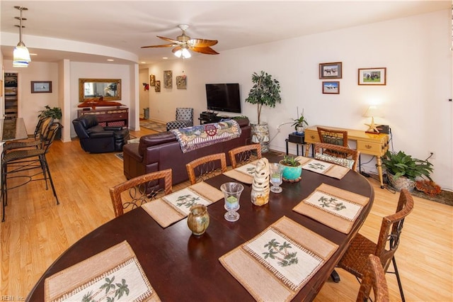 dining area featuring hardwood / wood-style flooring and ceiling fan