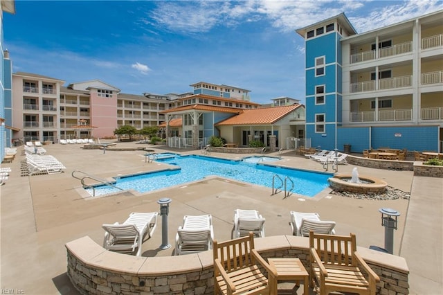 view of pool featuring a patio