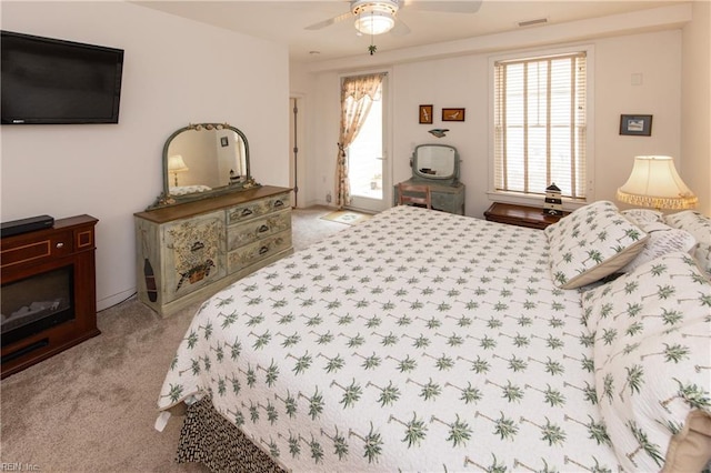 carpeted bedroom with ceiling fan