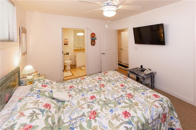 bedroom with ceiling fan and ensuite bathroom