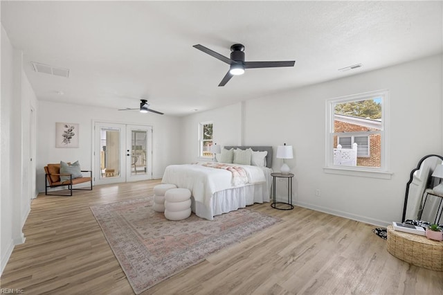 bedroom featuring light hardwood / wood-style flooring, french doors, ceiling fan, and access to outside