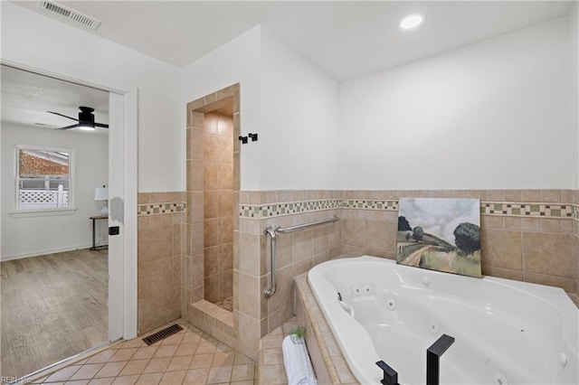 bathroom with tile patterned floors and plus walk in shower