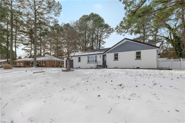 view of snow covered house