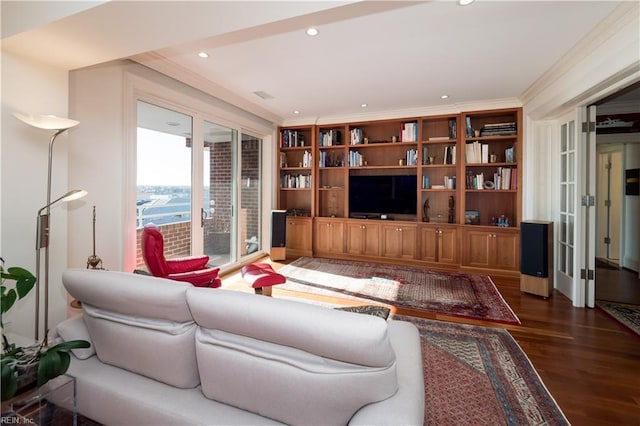 living room with ornamental molding and dark hardwood / wood-style flooring