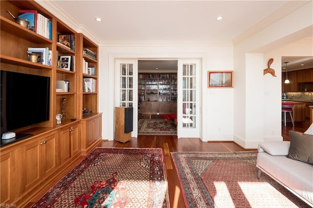 living room with ornamental molding, dark wood-type flooring, and french doors