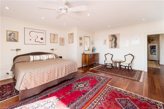 bedroom featuring crown molding, dark wood-type flooring, and ceiling fan