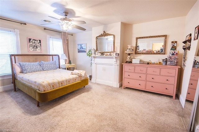 bedroom with light carpet and ceiling fan